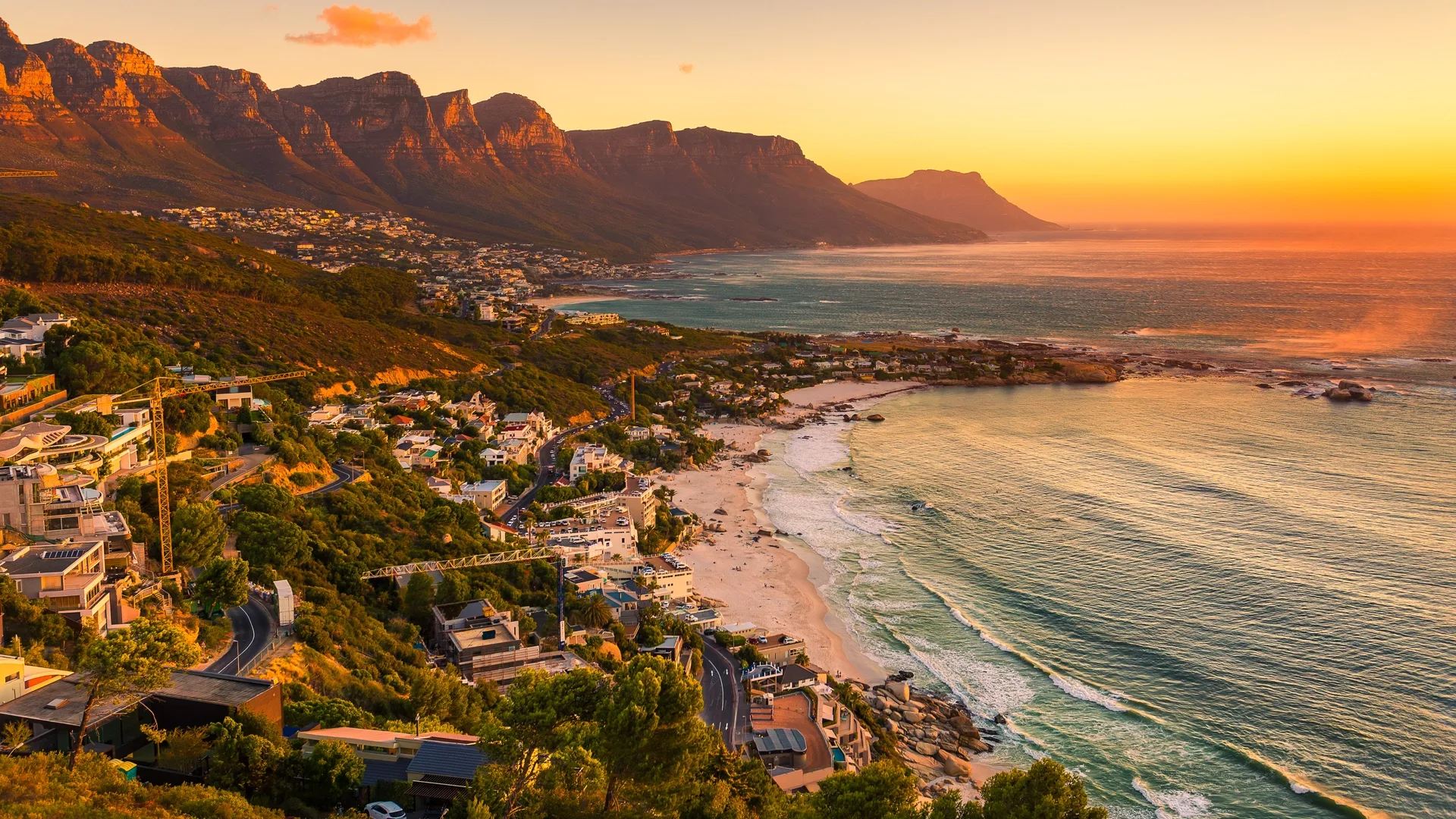 Cape Town beach with turquoise water and mountain backdrop